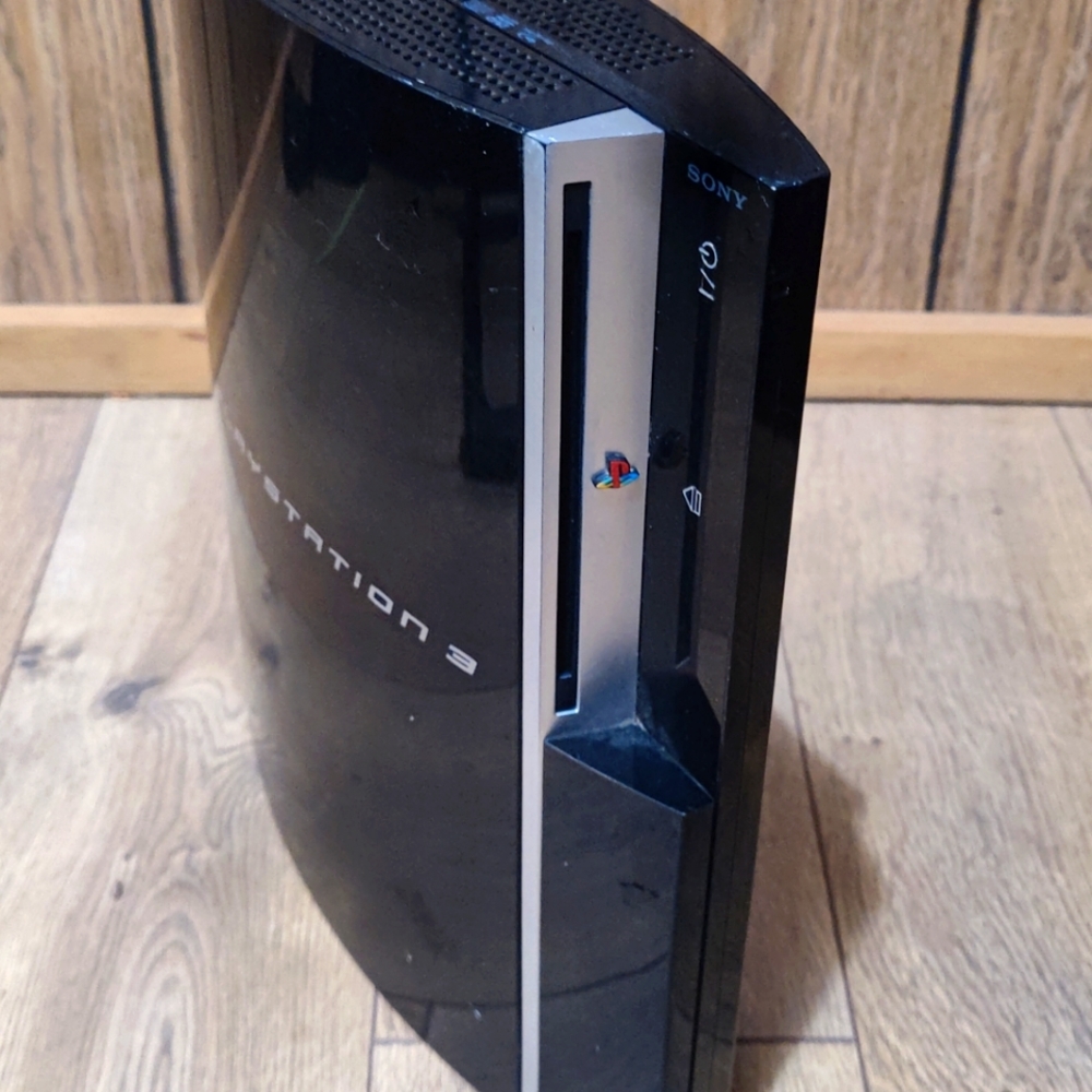 PlayStation 3 with 4 games & controller